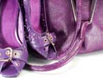 Purple color of handbag